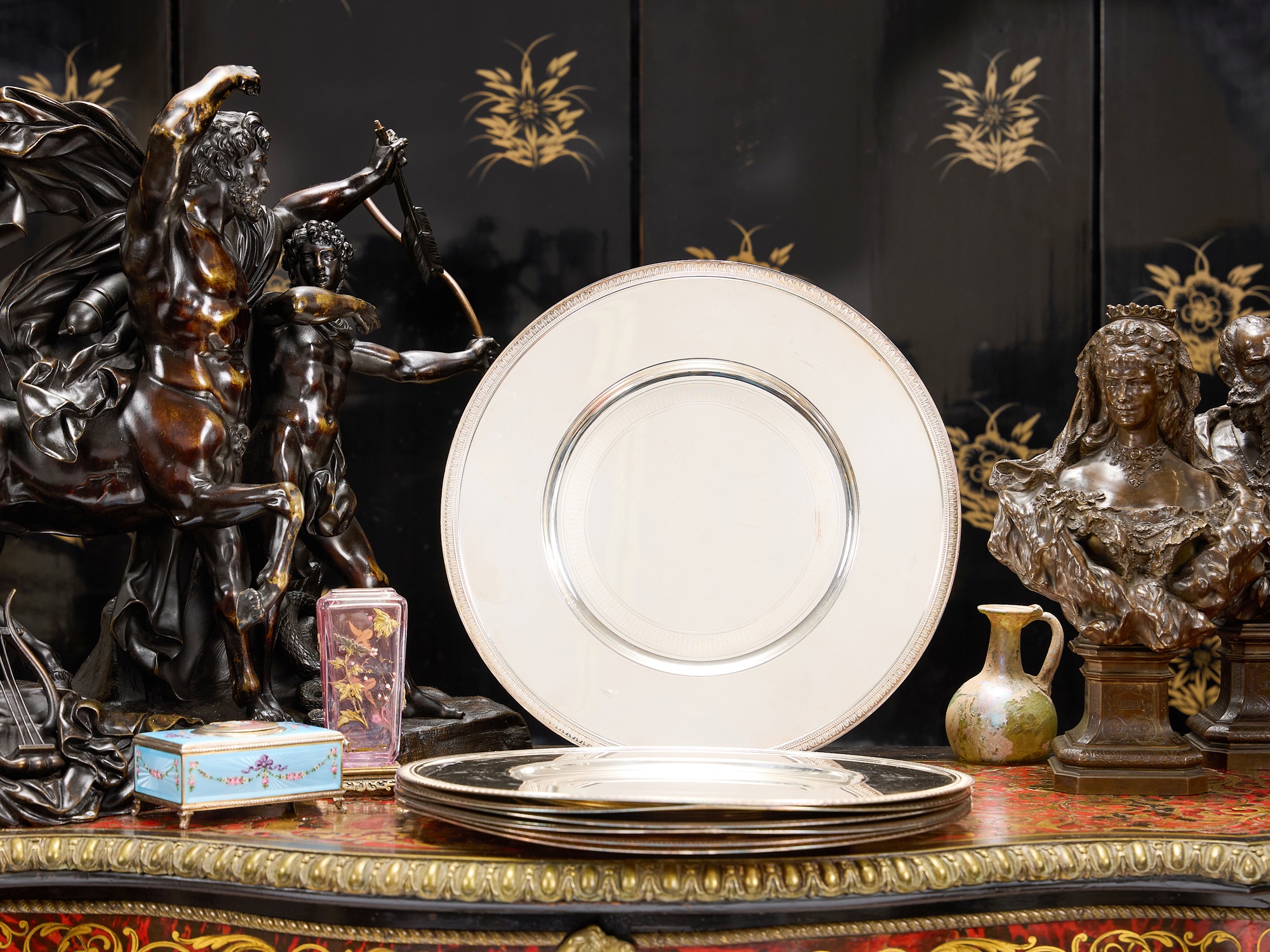 A SET OF CHRISTOFLE SILVER PLATED CHARGER PLATES