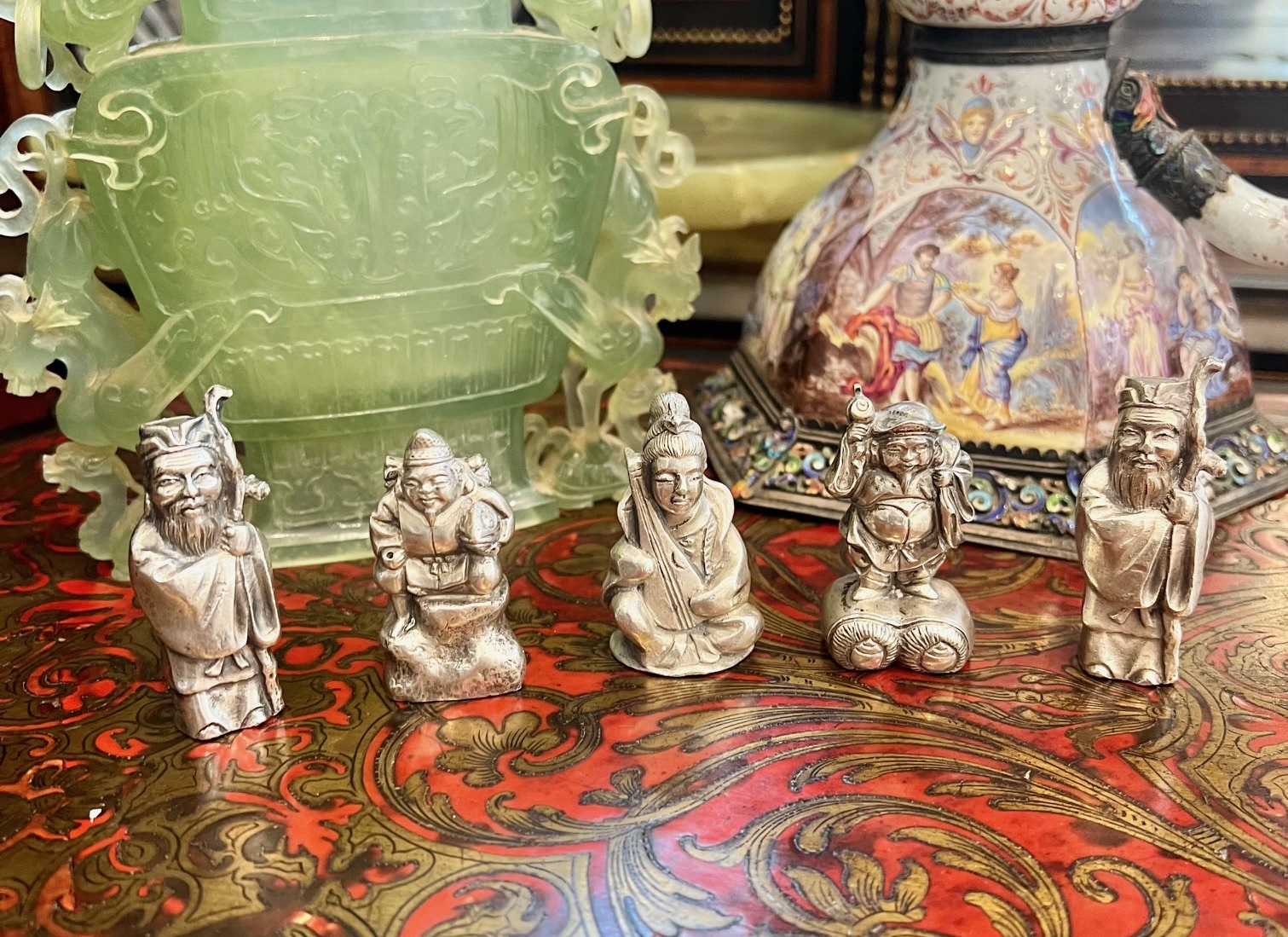 A SET OF FIVE SOLID SILVER CHINESE FIGURES