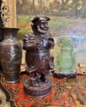 A 19TH CENTURY BLACK FOREST CARVED WOOD TOBACCO JAR MODELLED AS A NIGHT WATCHMAN