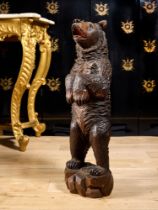 A LATE 19TH CENTURY BLACKFOREST CARVED WOOD STANDING BEAR