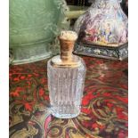 A 19TH CENTURY FRENCH CUT GLASS AND GOLD PERFUME BOTTLE