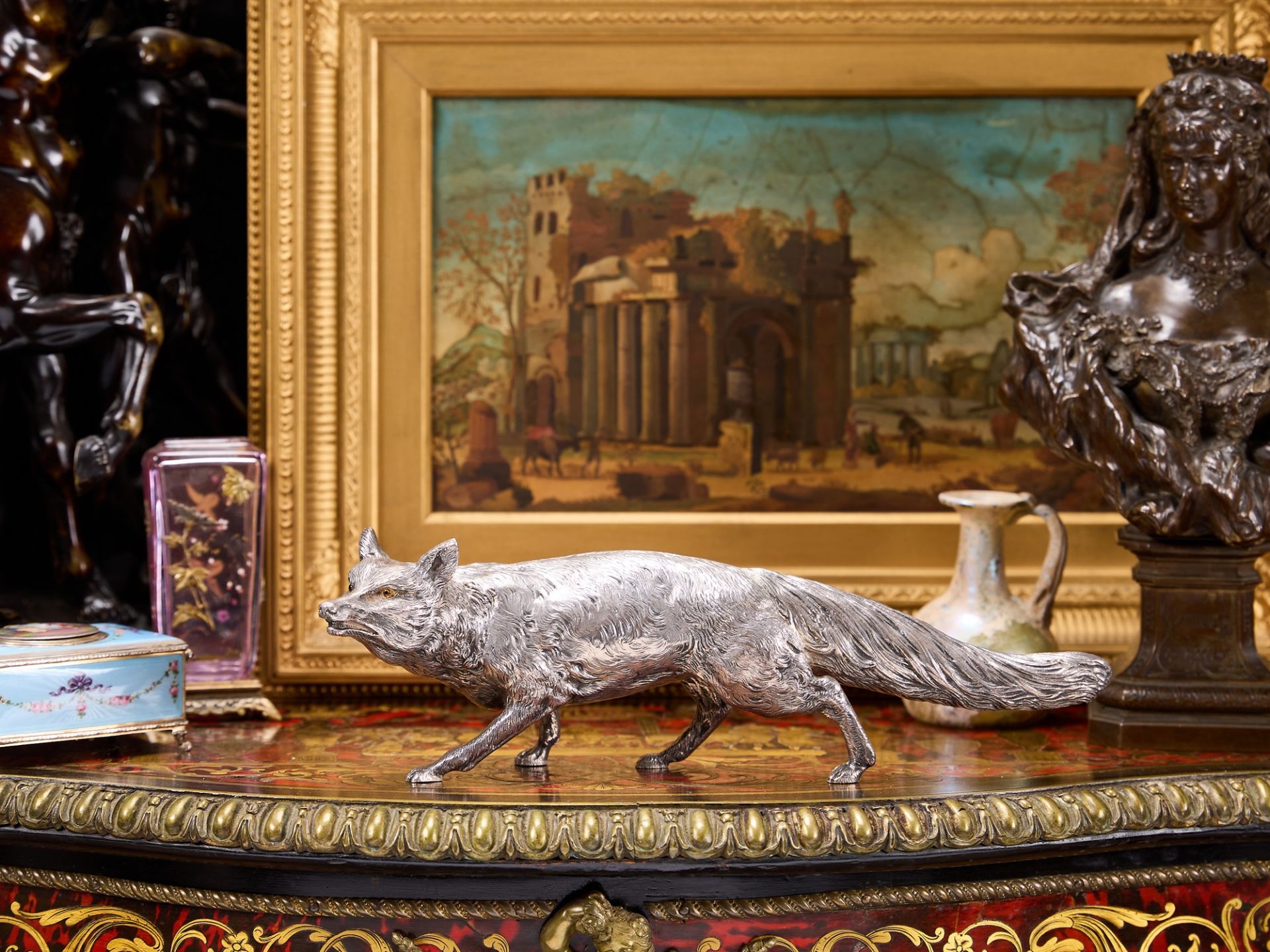 A STERLING SILVER MODEL OF A FOX