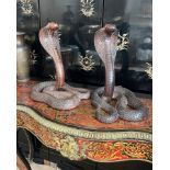 A PAIR OF INDIAN CARVED WOOD MODELS OF COBRAS WITH GLASS EYES