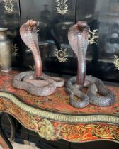 A PAIR OF INDIAN CARVED WOOD MODELS OF COBRAS WITH GLASS EYES