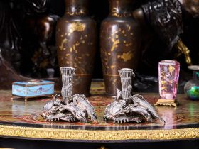 A PAIR OF ODIOT SILVER 'FISHERMAN'S CATCH' CANDLESTICKS