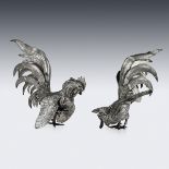 A PAIR OF GERMAN SILVER TABLE ORNAMENTS MODELLED AS FIGHTING COCKERELS