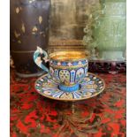 A SOLID SILVER GILT AND ENAMEL CUP AND SAUCER IN THE MANNER OF OVCHINNIKOV