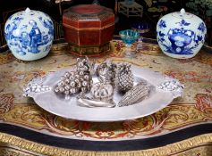 A LARGE SILVERED METAL TRAY AND A SELECTION OF FRUIT