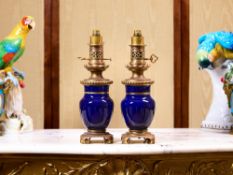 A PAIR OF LATE 19TH / EARLY 20TH CENTURY BLUE PORCELAIN AND ORMOLU MOUNTED LAMPS