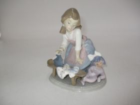 Lladro Figure of a Girl Ironing Dolls Clothes, 5782