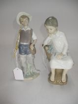 Two Lladro Figures of a Boy Fishing and a Boy Sitting