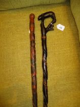 Two Carved Wood Walking Sticks