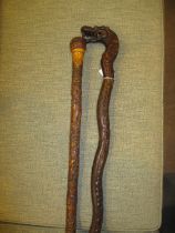 Two Chinese Carved Wood Walking Sticks