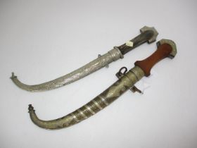 Two Middle Eastern Curved Blade Daggers