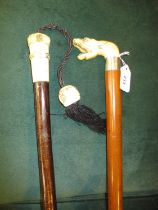 Two Carved Handle Walking Sticks