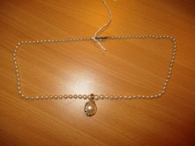 Mikimoto Pearl Necklace along with a Yellow Metal, Pearl and Diamond Clip on Pendant