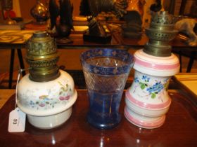 Two Victorian Porcelain Oil Lamps and a Blue Overlaid Glass Vase