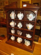 Display Shelves with 12 Franklin Mint Victoria & Albert Museum Teapots