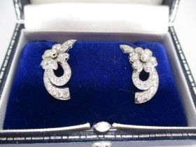 Pair of Diamond Flower Design Earrings Set in White Metal