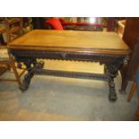 Victorian Gothic Carved Oak Library Table having a Frieze Drawer and Lion Mask Corners and Supports,