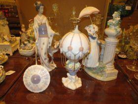 Two Lladro Figures and an Air Balloon Ornament