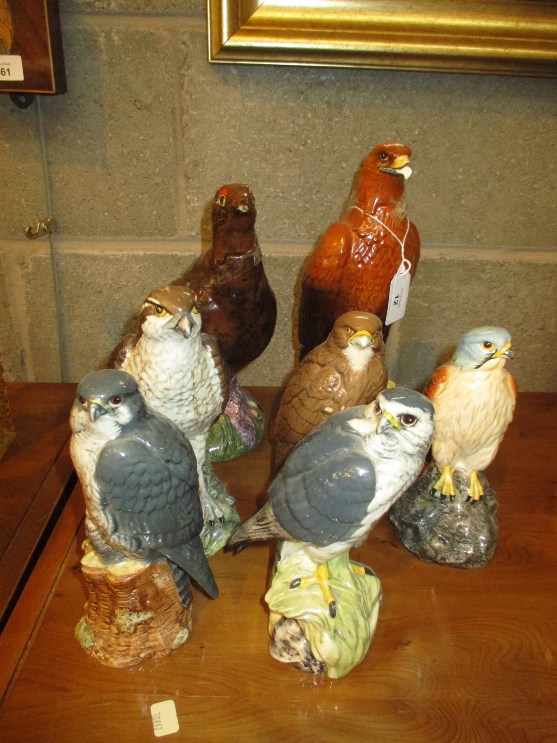 Six Beswick Beneagles Whisky Decanters and Beswick Famous Grouse Whisky Decanter, all full