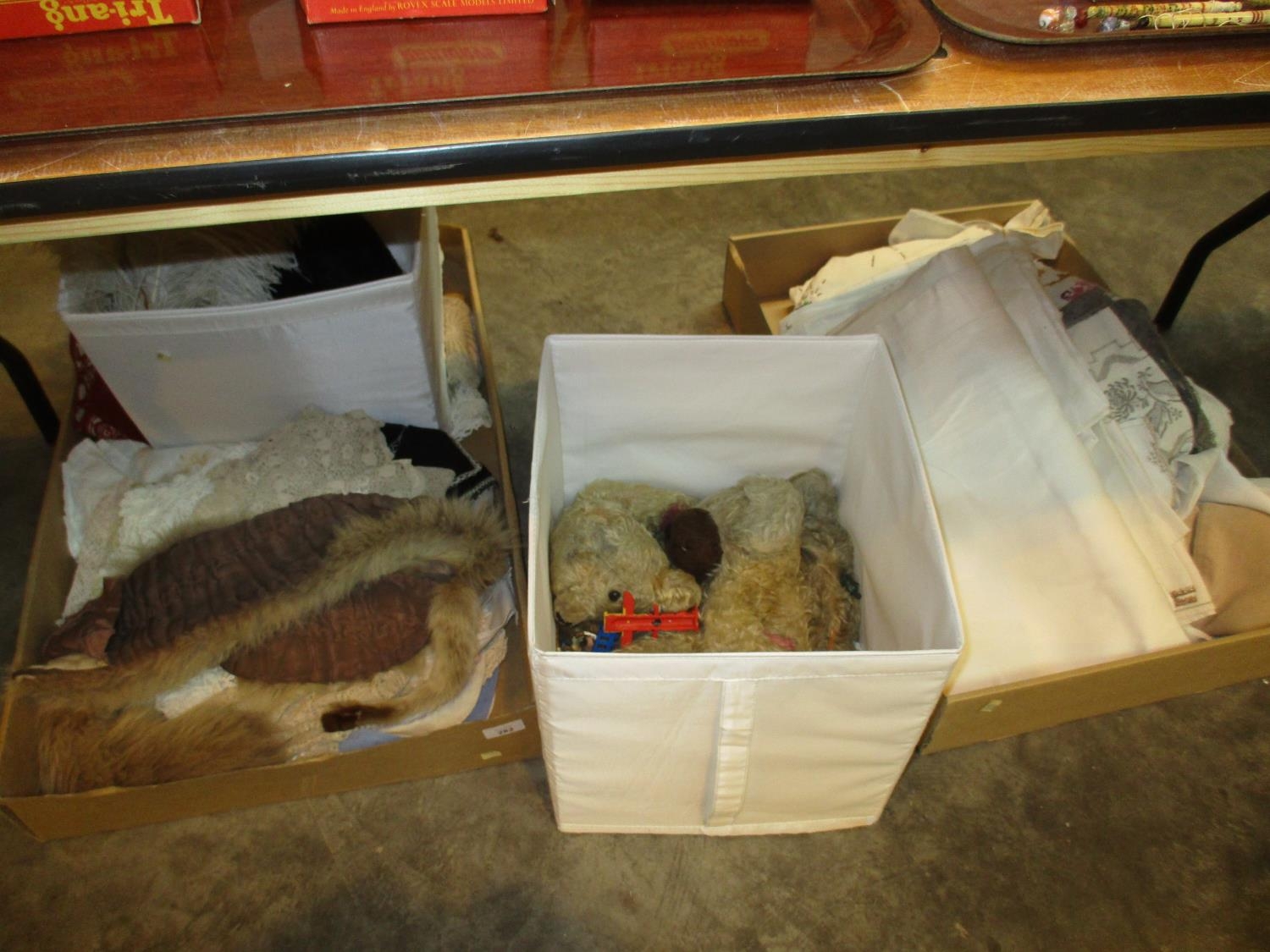 Four Boxes of Linen, Fur, Feathers and Toys