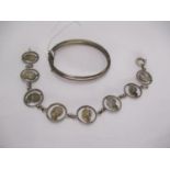 Childs Silver Bangle by Charles Horner, Chester 1914, and a Cut Out Coin Bracelet