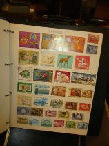 Four Albums with a Good Collection of World Stamps