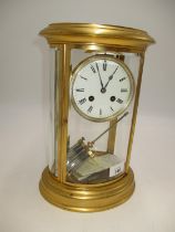 Victorian Oval Brass and Bevelled Glass Mantel Clock by Japy Freres having a Mercury Pendulum