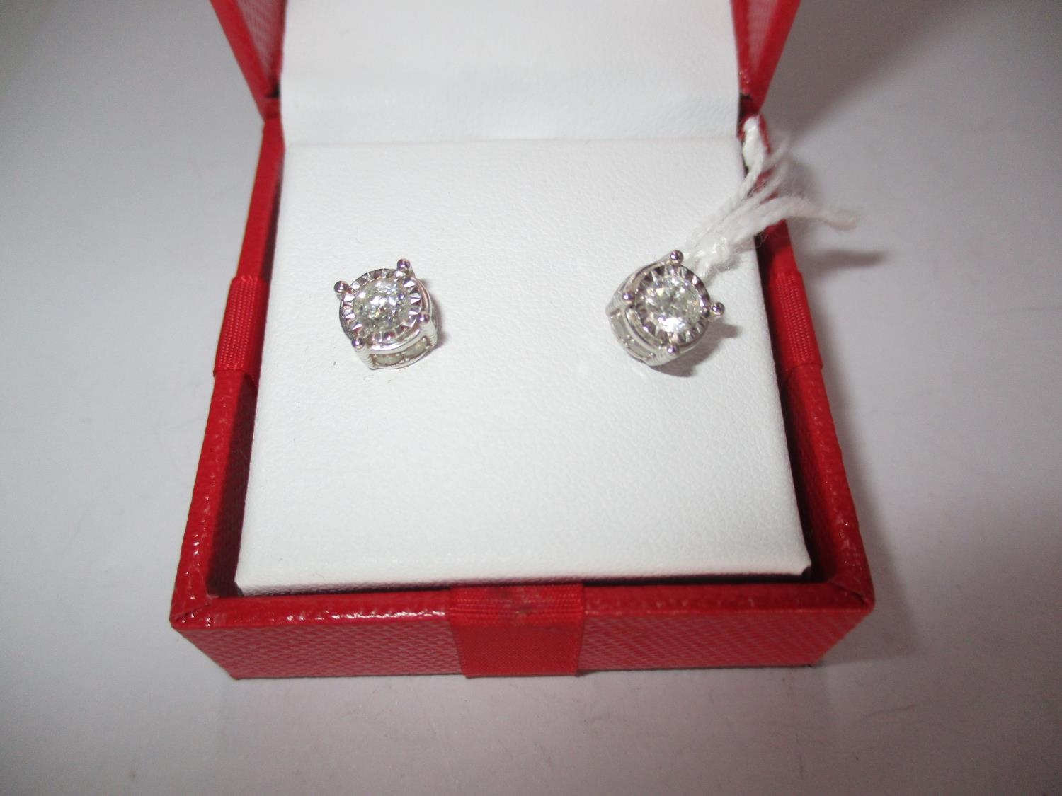 Pair of 14K White Gold and Diamond Earrings, total diamond weight 1.250 cts