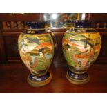 Pair of Japanese Pottery Vases, 25cm high, with Wooden Stands