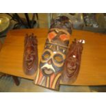 Three African Carved Wood Mask Plaques