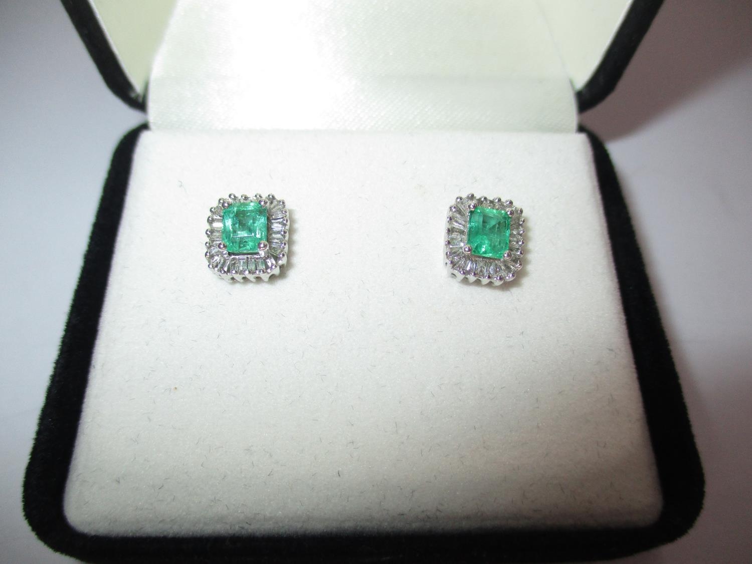 Pair of 18K White Gold Colombian Emerald and Diamond Stud Earrings, total gem weight 1.250 cts