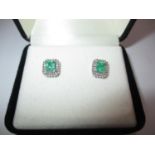 Pair of 18K White Gold Colombian Emerald and Diamond Stud Earrings, total gem weight 1.250 cts