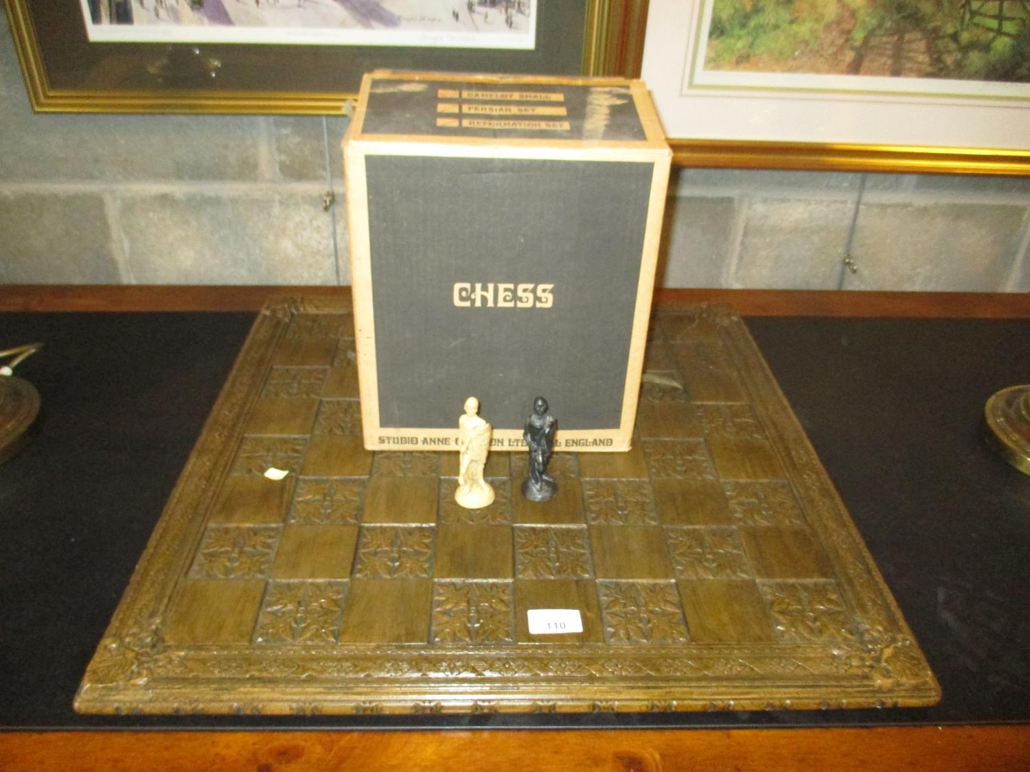Camelot Chess Set by Studio Anne Carlton Ltd, along with a Chess Board