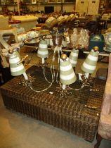 Ornate Pendant Chandelier and a Wicker and Glass Coffee Table