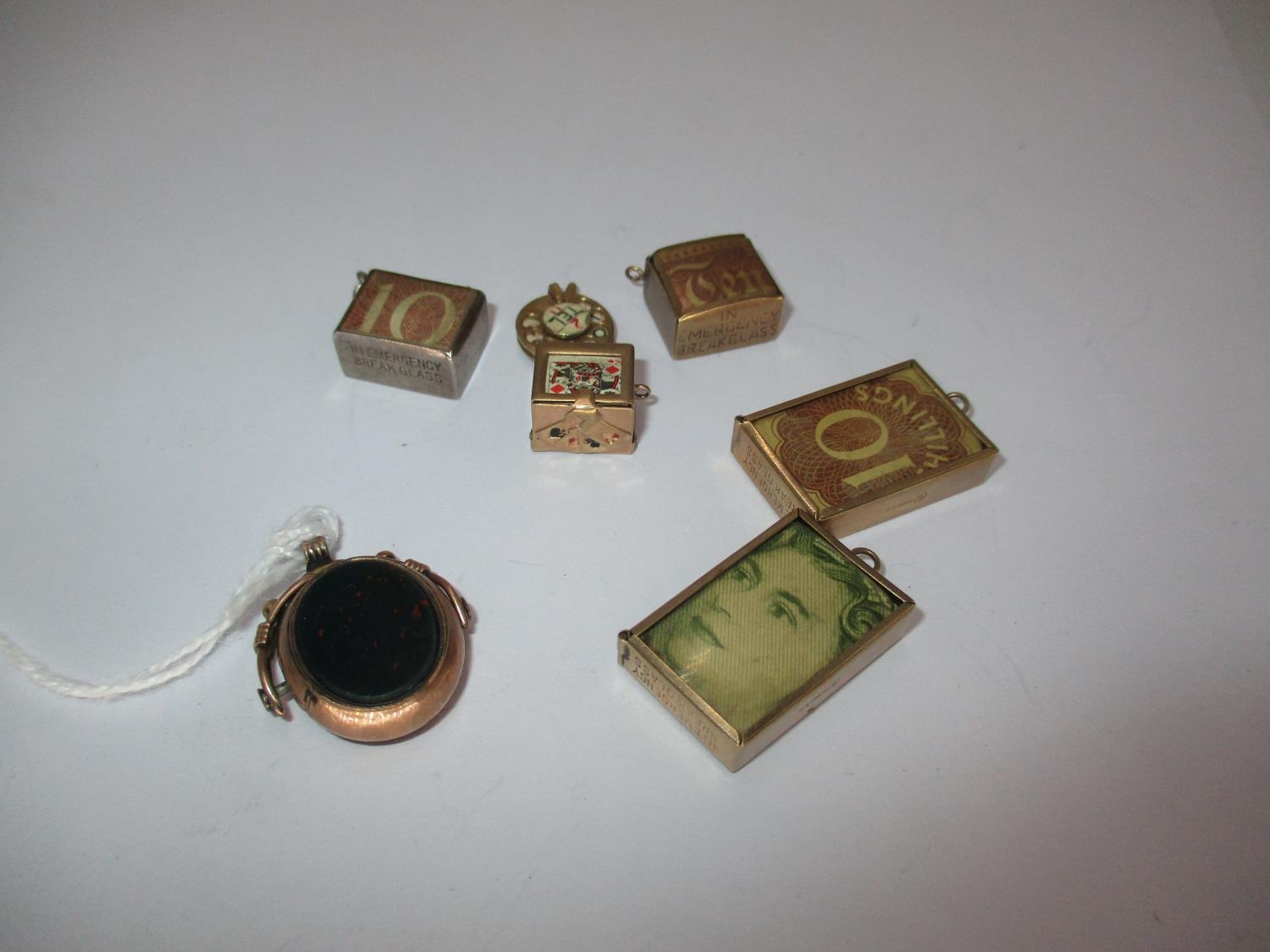 Three 9ct Gold Bank Note Pendants, 9ct Gold Telephone Dial Pendants, 2 Other Pendants and a 9ct Gold