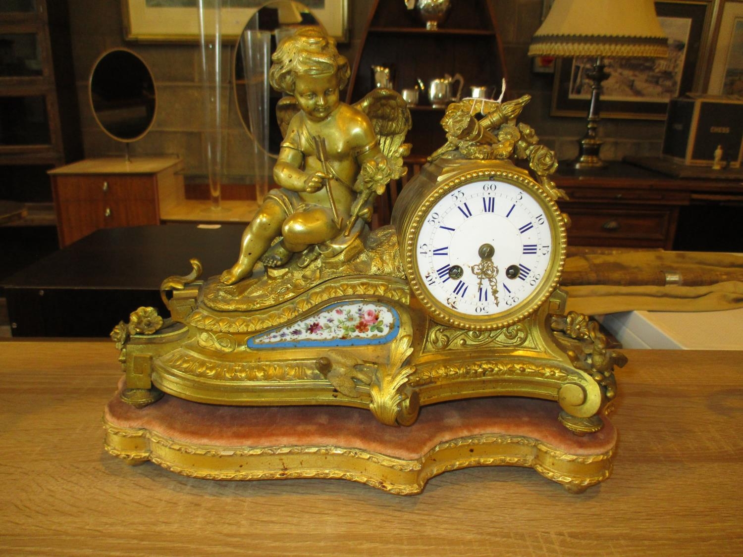 Victorian Gilt Metal and Porcelain Panel Clock Surmounted by a Cherub, The Movement by H. Marc