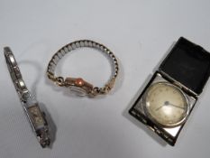TWO VINTAGE LADIES WATCHES TOGETHER WITH A SMALL VINTAGE TRAVEL CLOCK
