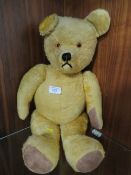 A VINTAGE MOHAIR JOINTED BEAR APPROX HEIGHT 60CM VENDOR ADVISES ORIGINAL HAND MADE BY A LADY WHO