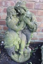 A CONCRETE STATUE DEPICTING A PAIR OF LOVERS ROMEO AND JULIET STYLE BY LUCAS