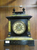 A VINTAGE CASED WOODEN MANTLE CLOCK