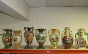 A COLLECTION OF DECORATIVE TWIN HANDLE VASES (7)