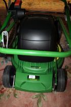 AN ELECTRIC JOHN DEERE LAWN MOWER