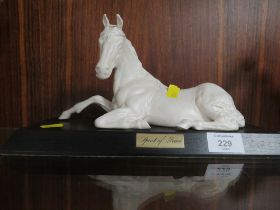 A SPIRIT OF PEACE MATTE FINISH CERAMIC MODEL OF A HORSE