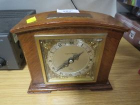 A WOODEN CASED ELLIOTT MANTLE CLOCK RETAILED BY MAPPIN AND WEBB WITH DEDICATED MAP TO TOP