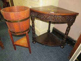 AN OAK BARREL PLANTER TOGETHER WITH A CARVED CORNER TABLE