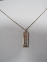 A MENS VINTAGE 1 oz SILVER INGOT ON A SILVER CHAIN