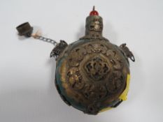 A TIBETAN JADE STYLE TABLE SNUFF BOTTLE WITH DECORATIVE METAL OVERLAYS , LID HAVING A REPLACEMENT